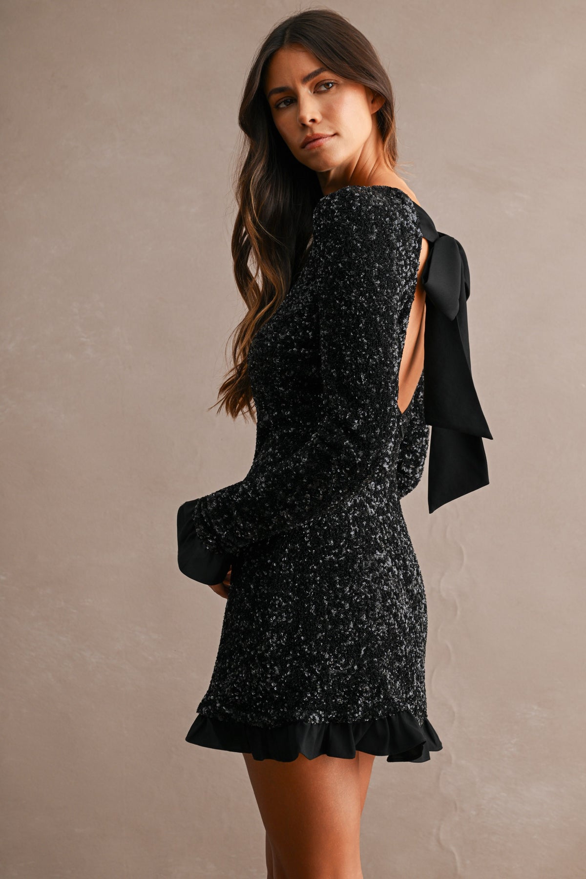 Cecilia Sequin Long Sleeve Ruffle Trim Open Back Bow Tie Mini Dress