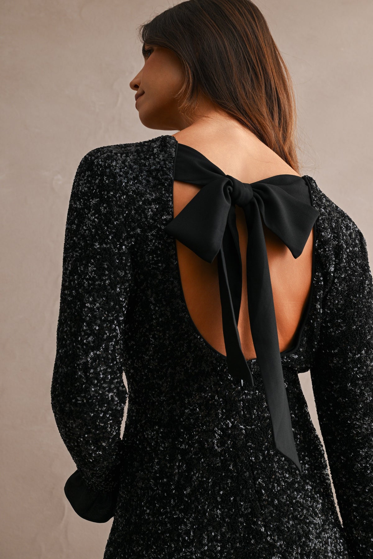 Cecilia Sequin Long Sleeve Ruffle Trim Open Back Bow Tie Mini Dress